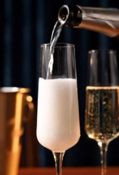Champagne being poured into a champagne flute