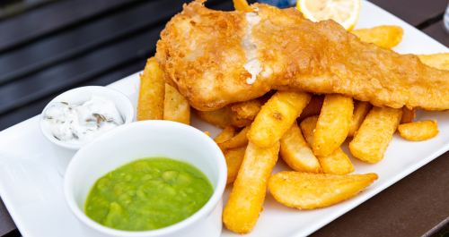 Plate of fish, chips and mushy peas