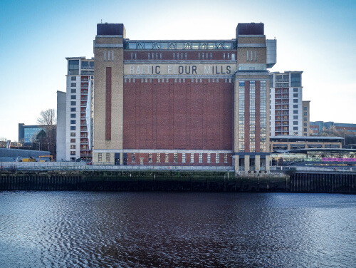 Baltic Art building by a body of water