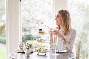 Woman having afternoon tea