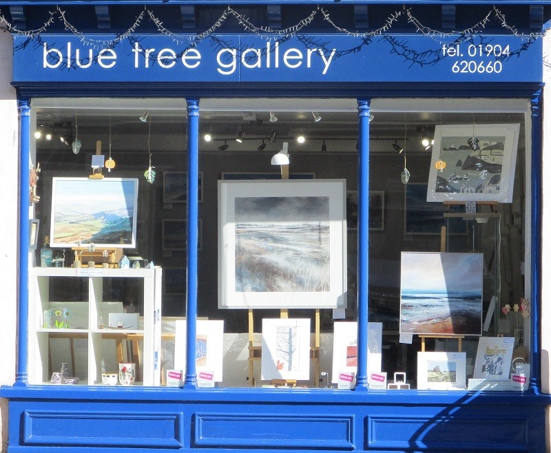 Blue Tree Gallery shopfront with paintings in the window