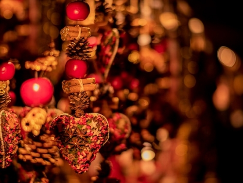 Christmas decorations hanging up at a Christmas market stall