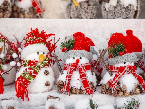 Small fake snowmen on sale at a Christmas market