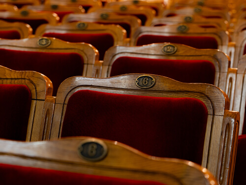 Seats in a theatre, none are occupied.