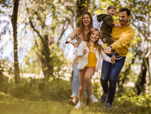 Family walking in the woods