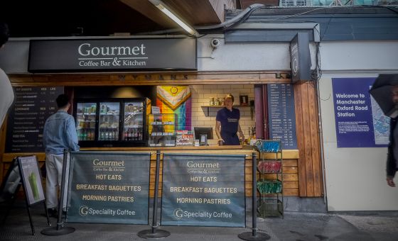 Staff serving customer at Gourmet Coffee Bar and Kitchen