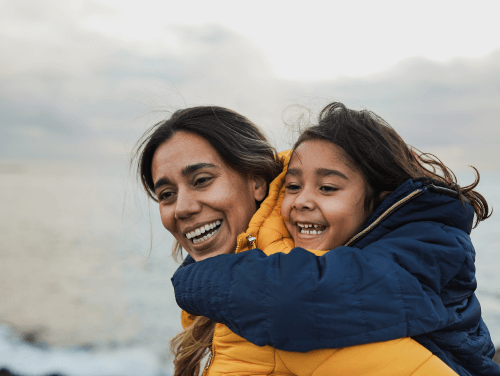 Mother and daughter smiling 
