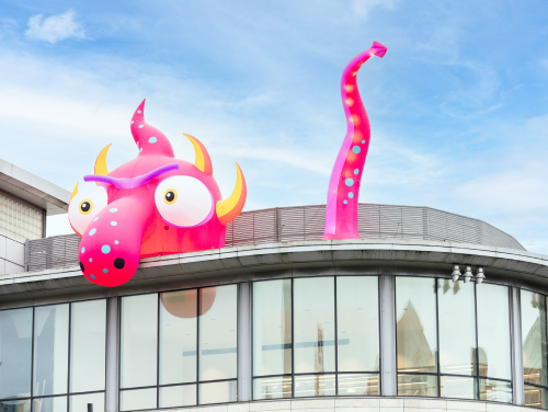 Inflatable monster on top of a building in Manchester