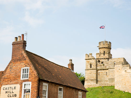 Lincoln Castle with Castle Hill Club in the foreground