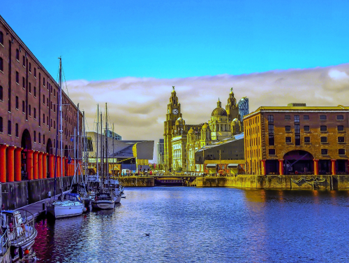Liverpool at dusk with body of water in the foreground