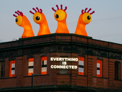 Giant four-eyed monster on top of a building in Manchester