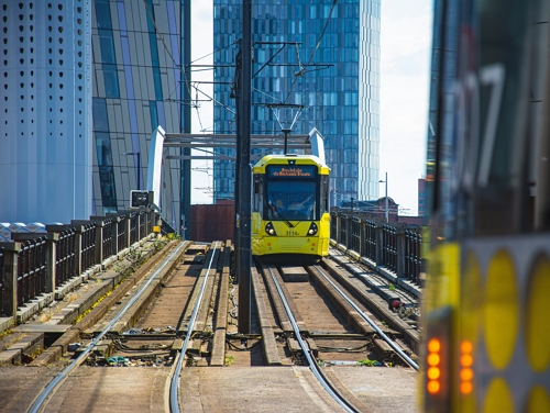 A train crossing a bridge in Manchester
