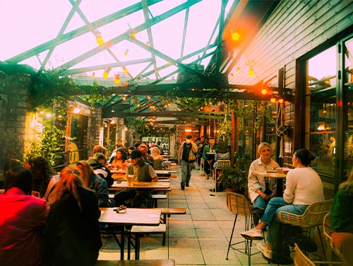 YES rooftop bar in Manchester busy with people sitting at tables