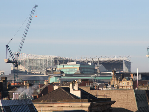 A long shot view of St James' Park from outside the park.