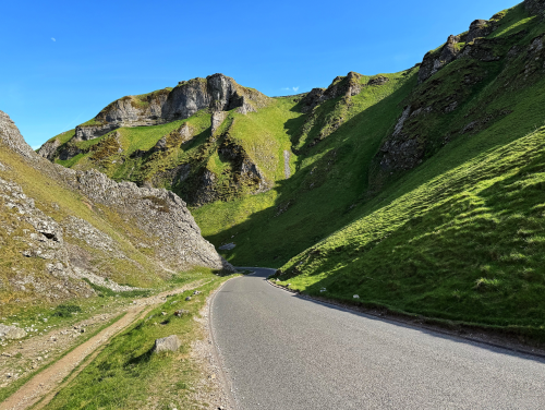 The Limestone Way on a sunny day under blue skies.