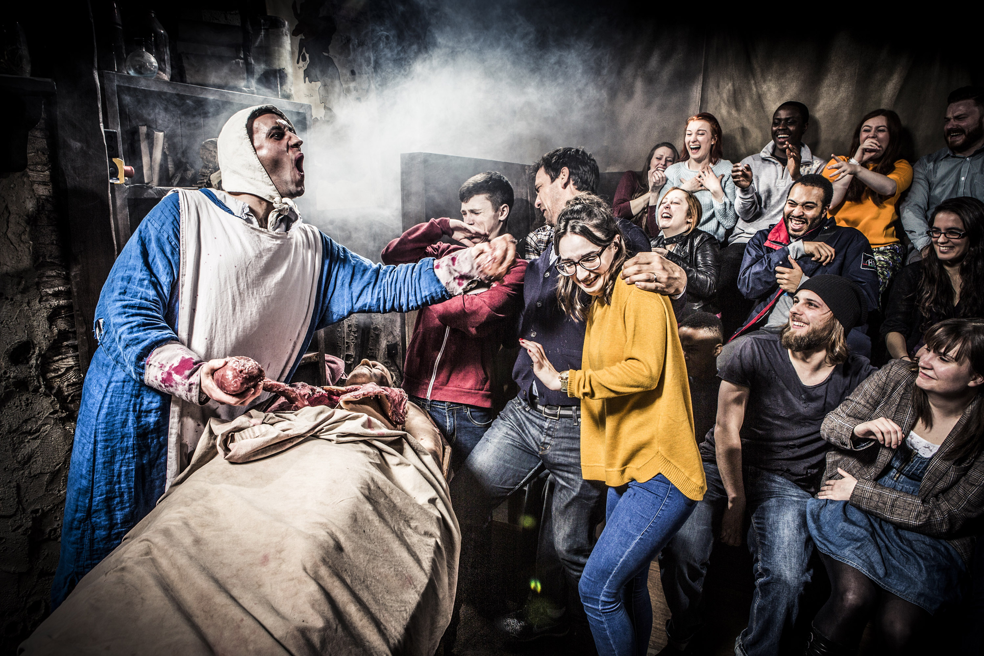 Image of an exhibition in York Dungeons with a grown watching a gruesome scene