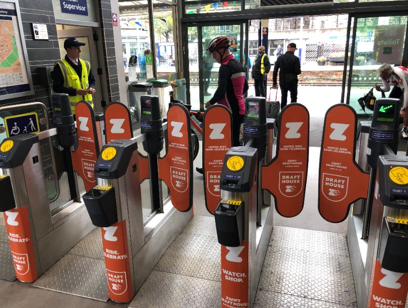 Watch shop brand ticket gatelines at a train station