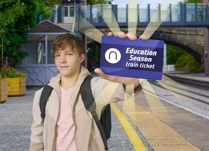 College student holding an Education Season ticket on a train platform