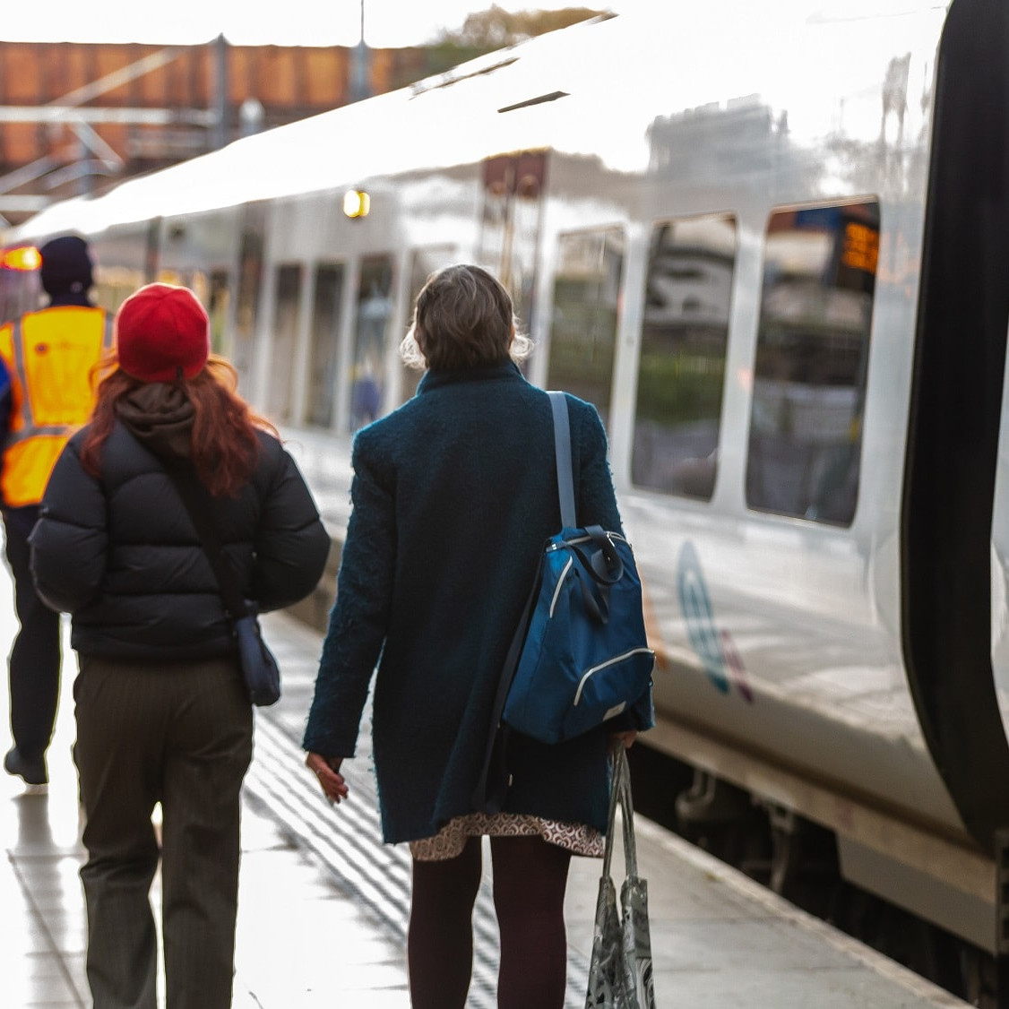 Image shows commuters alongside Northern train cropped