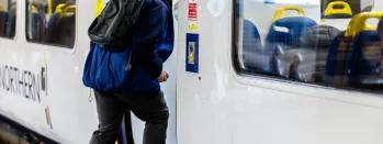 Image shows customer boarding a train image-shows-customer-boarding-a-train