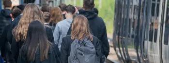 Image shows schoolchildren alongside a Northern train at a platform image-shows-schoolchildren-alongside-a-northern-train-at-a-platform