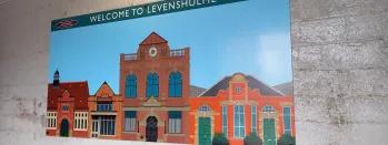 This image shows art at Levenshulme depicting the Antique Village this-image-shows-art-at-levenshulme-depicting-the-antique-village