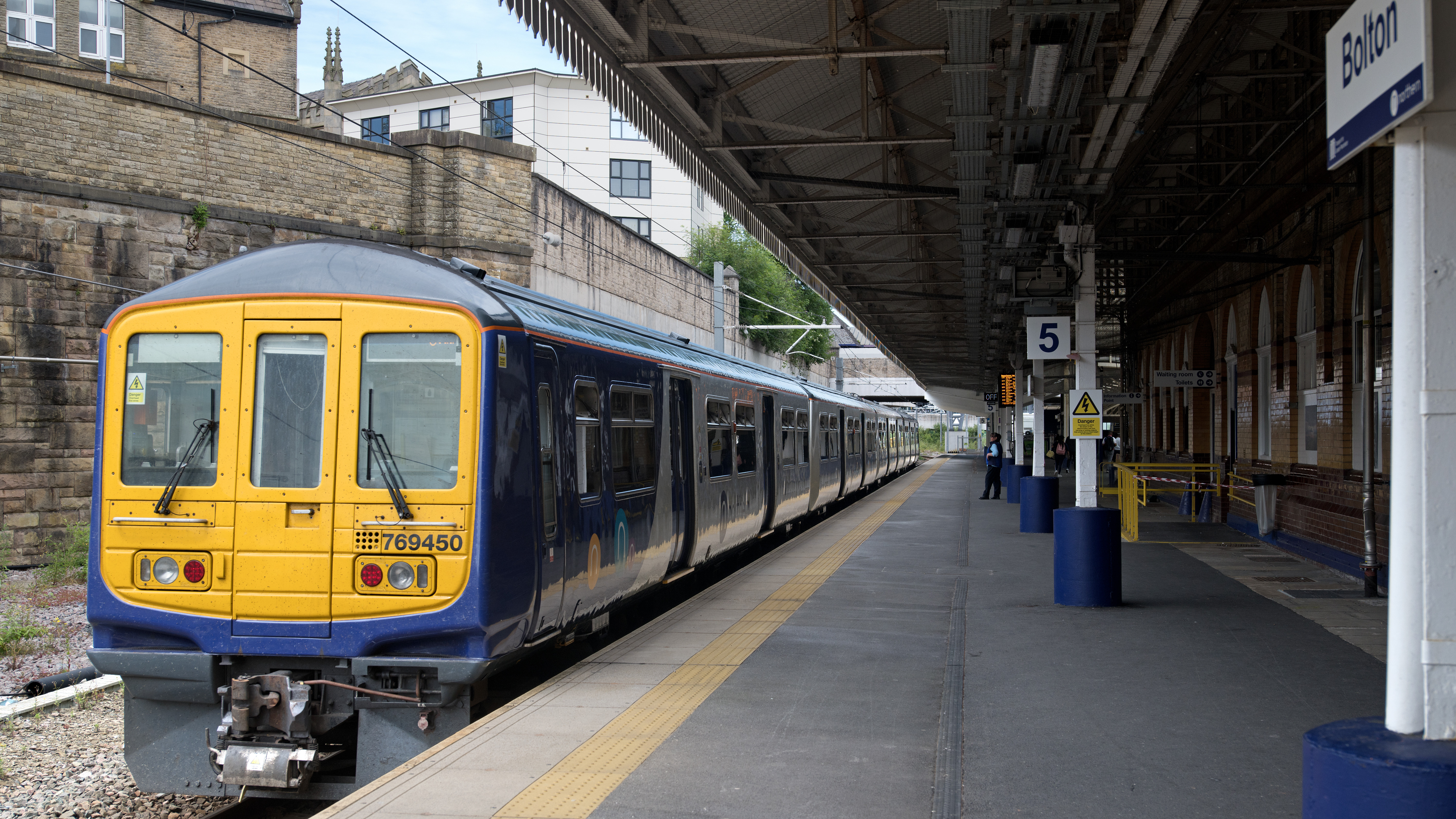 A Northern train waits at platform 5 at Bolton station