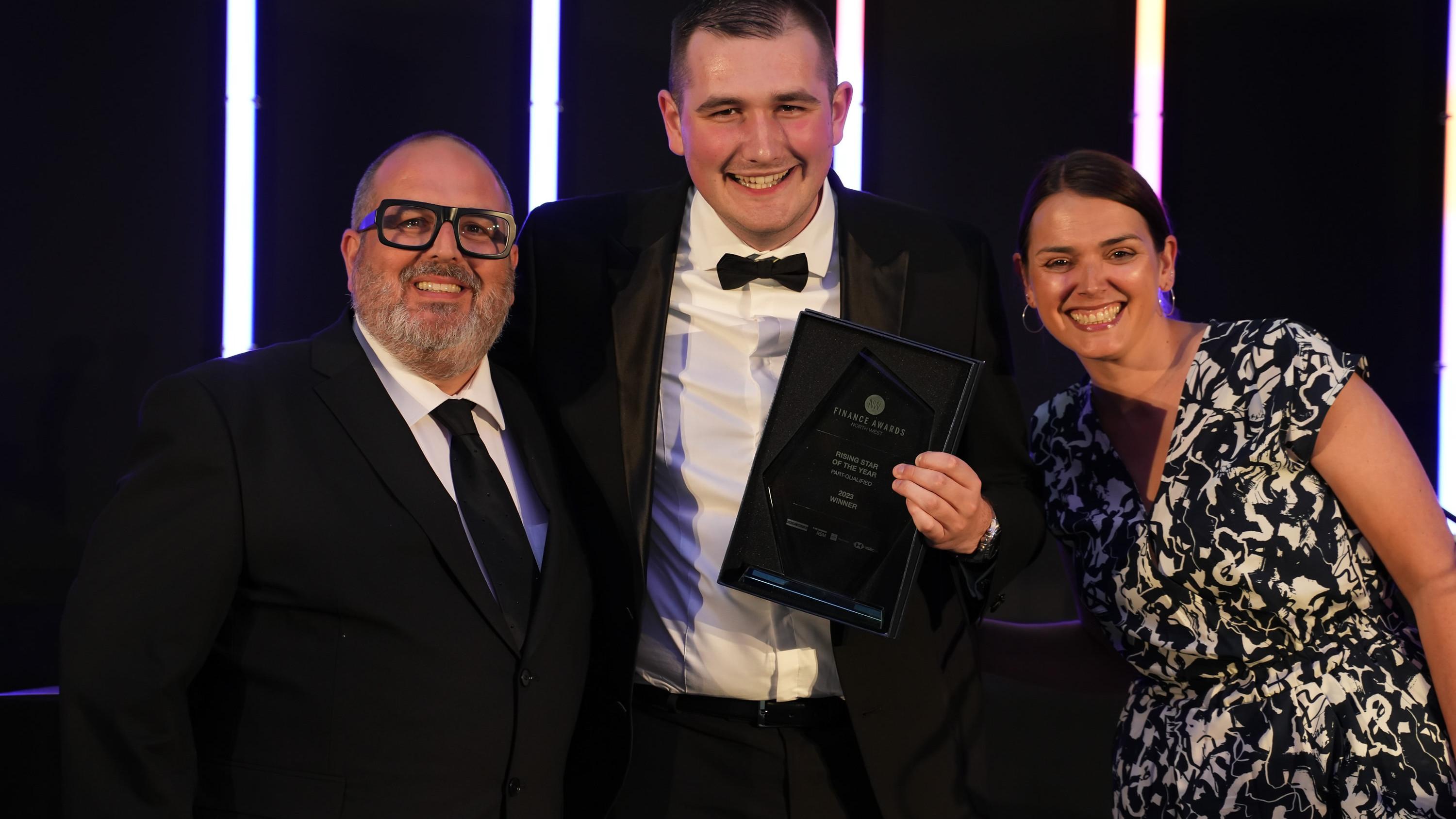 Image shows Alfie Lamb collecting his Rising Star award at the Finance Awards North West