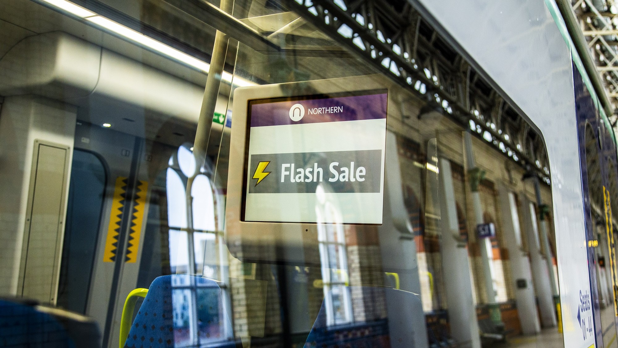 Image shows Flash Sale signage on-board Northern train