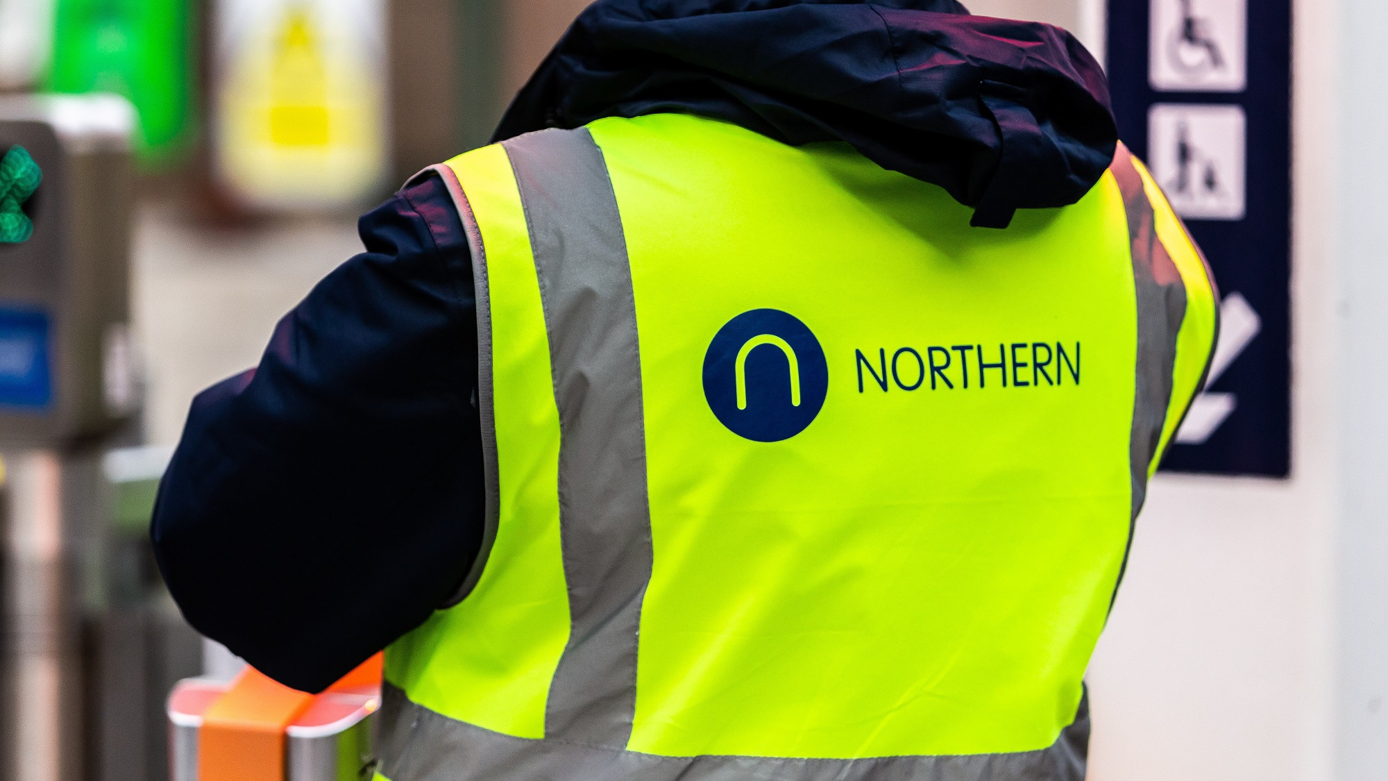 Image shows Northern colleague at a ticket gateline