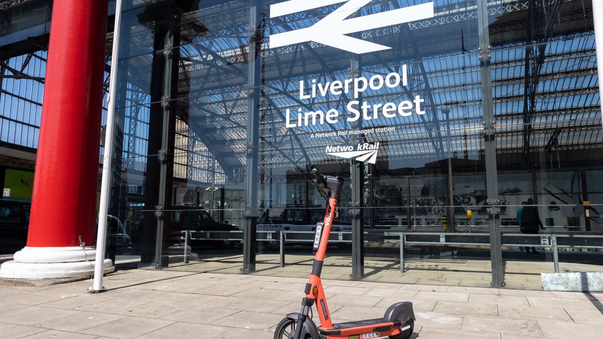 Image shows VOI scooter outside Liverpool Lime Street station