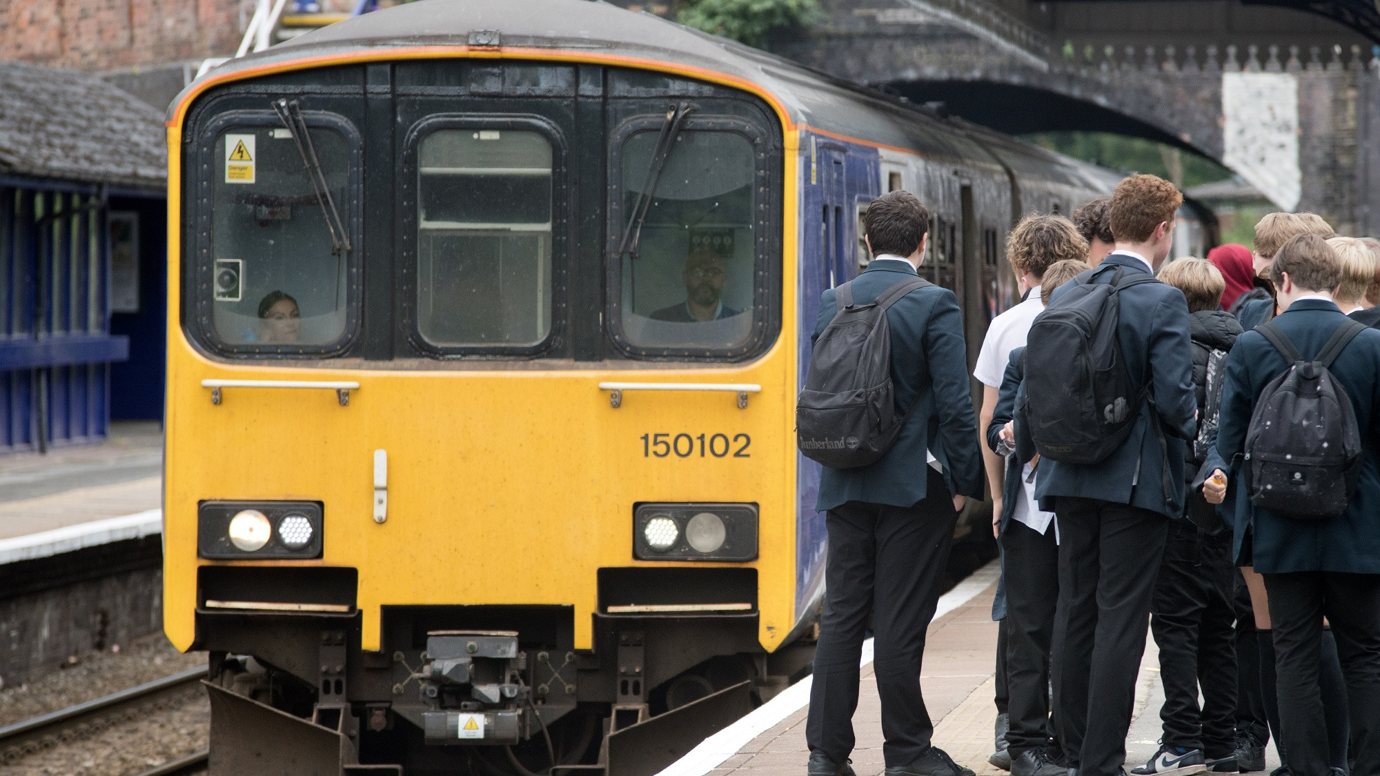 School students boarding a Northern service