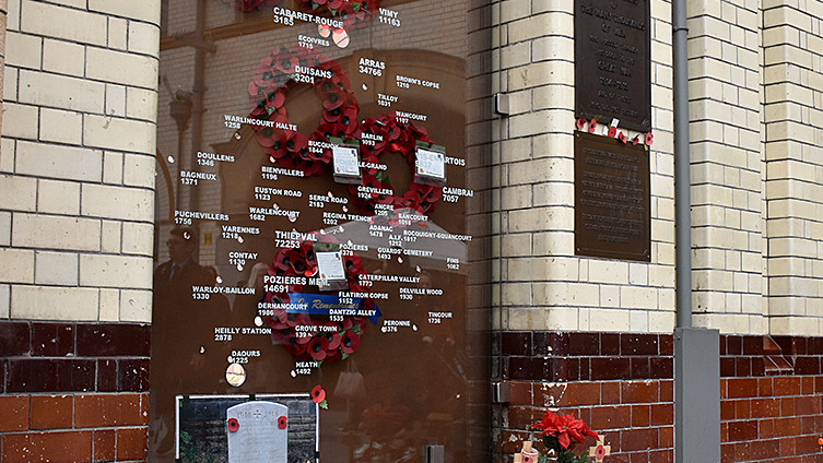 Soldiers gate poppies