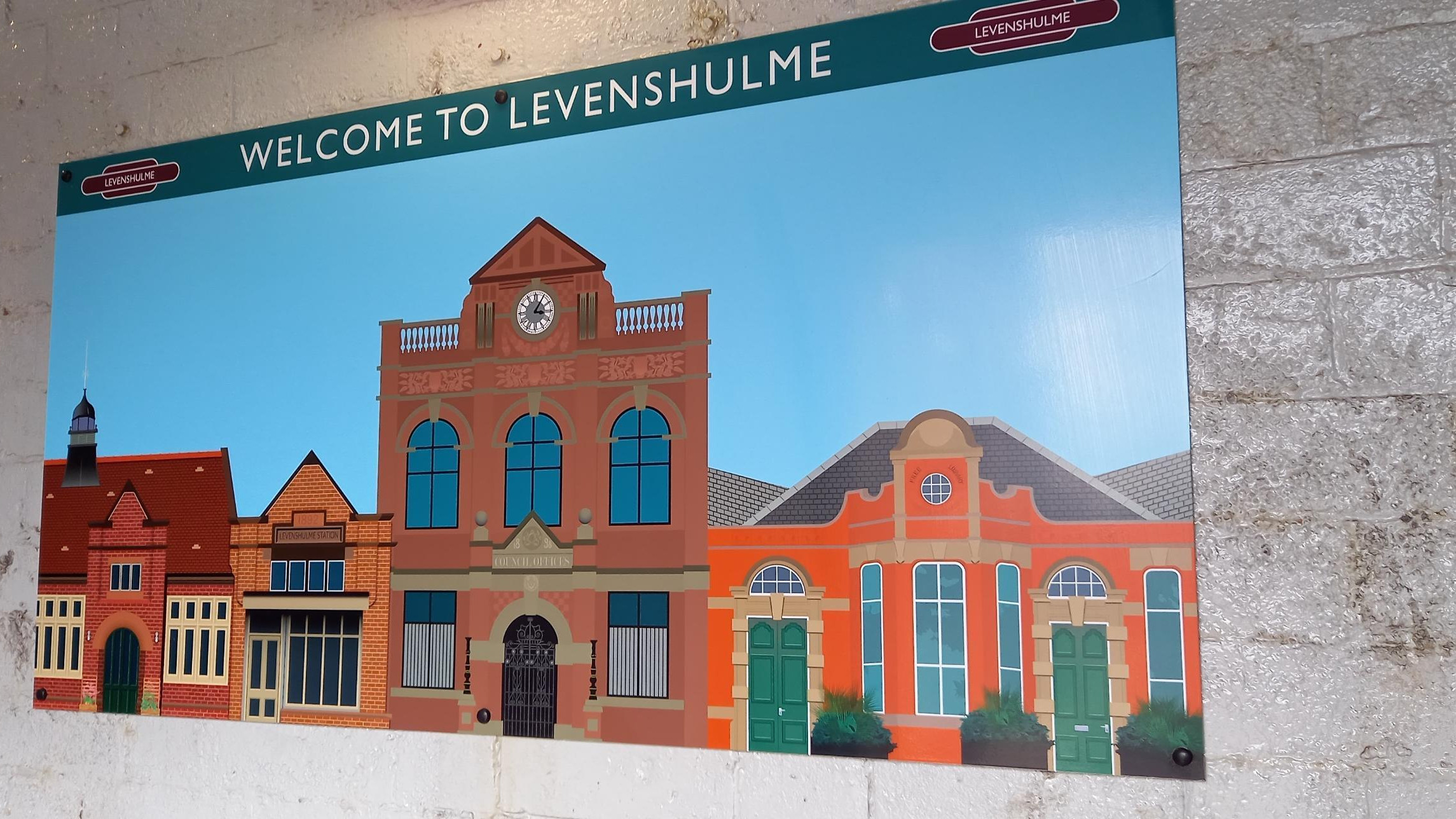 This image shows art at Levenshulme depicting the Antique Village