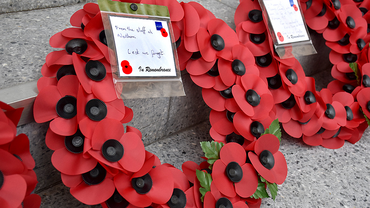 This image shows poppy wreaths at Soldiers Gate in Manchester Victoria station