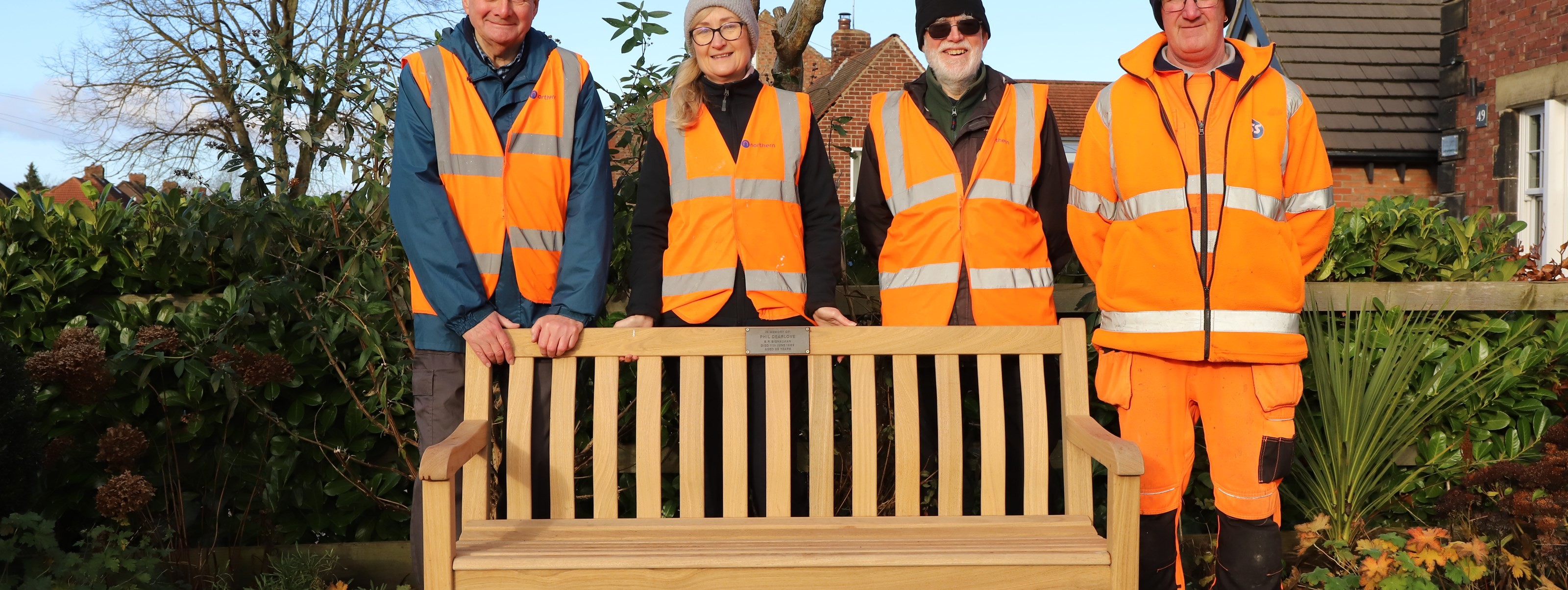 this-image-shows-the-poppleton-memorial-bench-alongside-station-volunteers